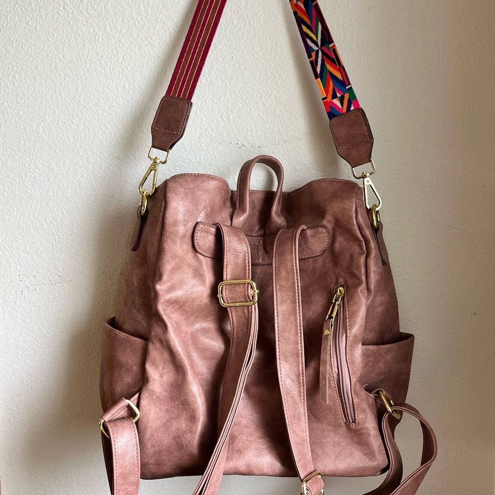 Vegan leather pink backpack purse.